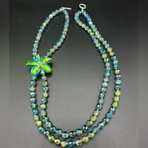 Elegant Blue/Green Crystal Bead Double Strand Necklace with Floral Accent.